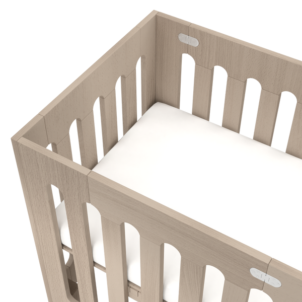 Fold up mini crib sales